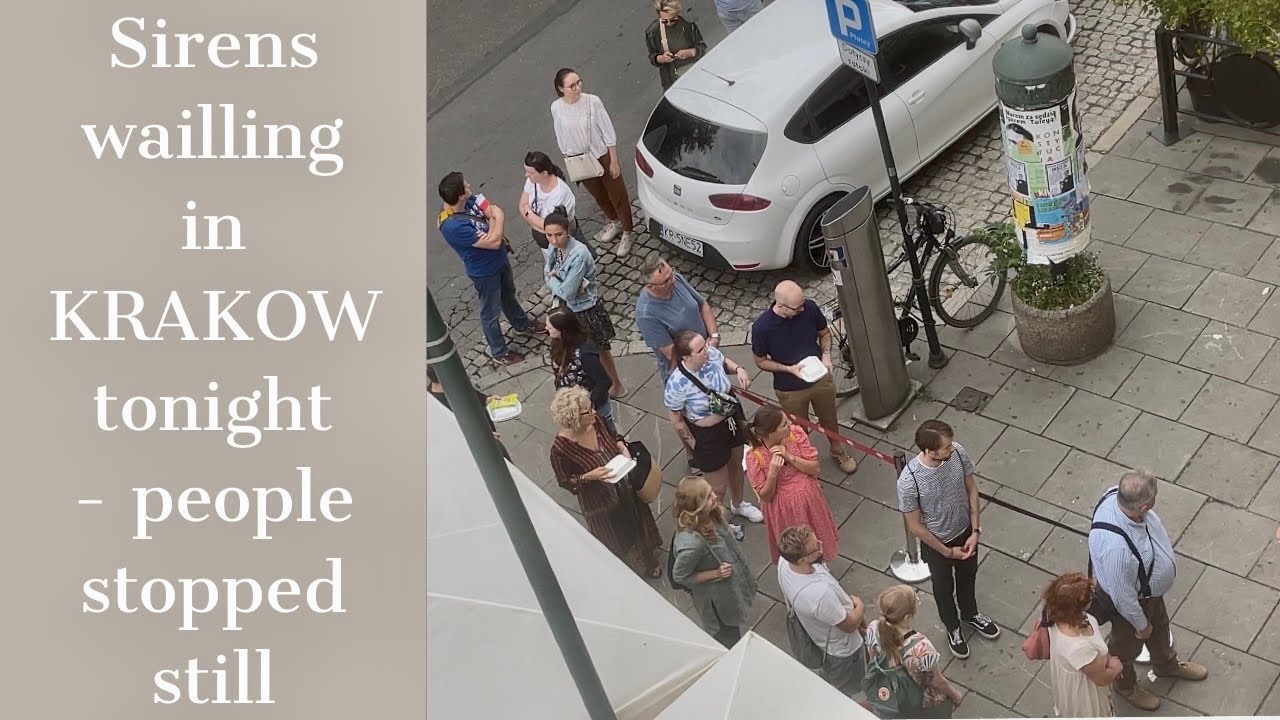 Sirens wailling over KRAKOW, Poland tonight. People stopped still. Hear them & find out why...