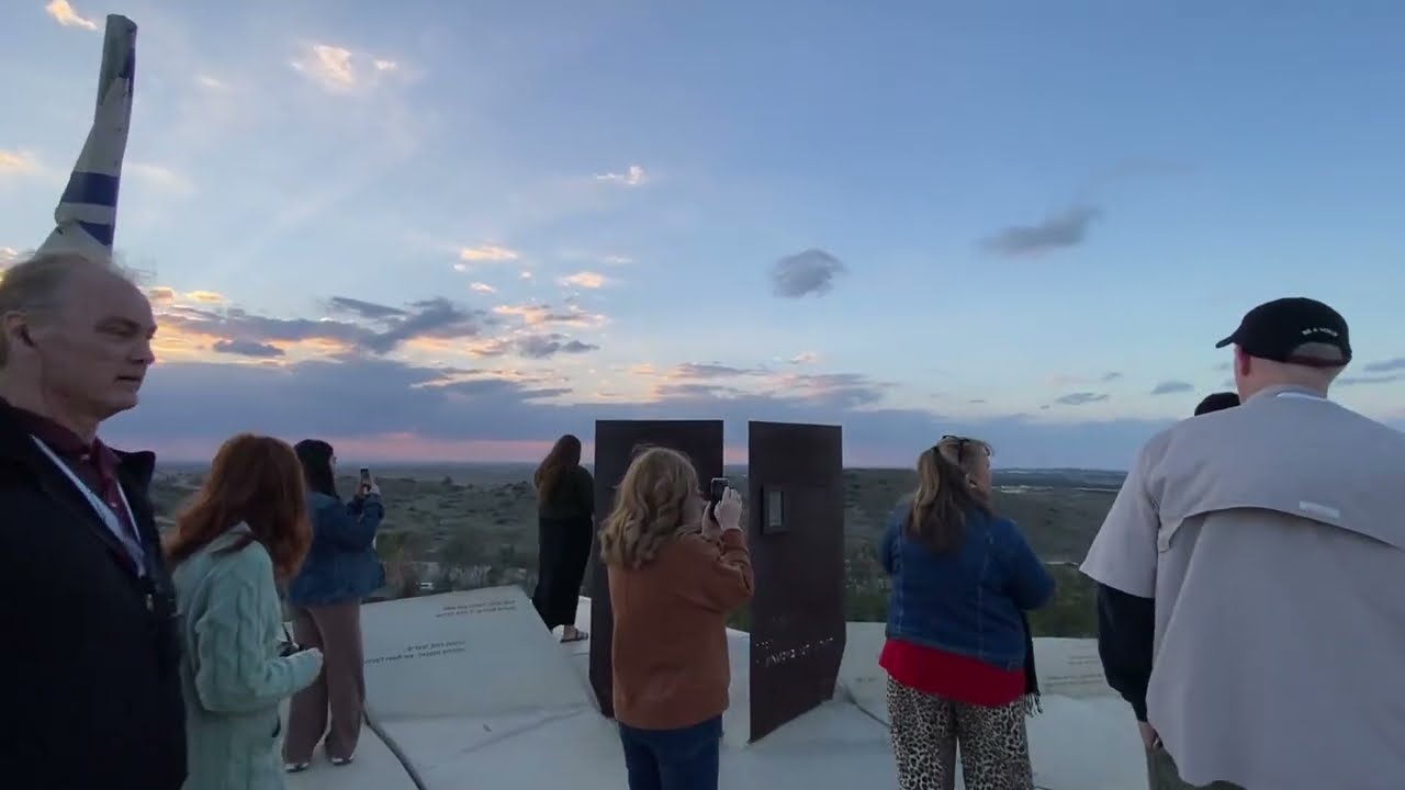 At a viewpoint in Sderot, praying and praising while looking at the Gaza Strip.