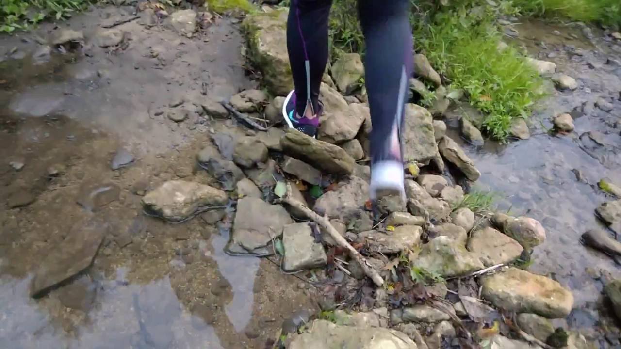 Her sockless Nike Lunartempo wet, muddy and trashing his Nikes.