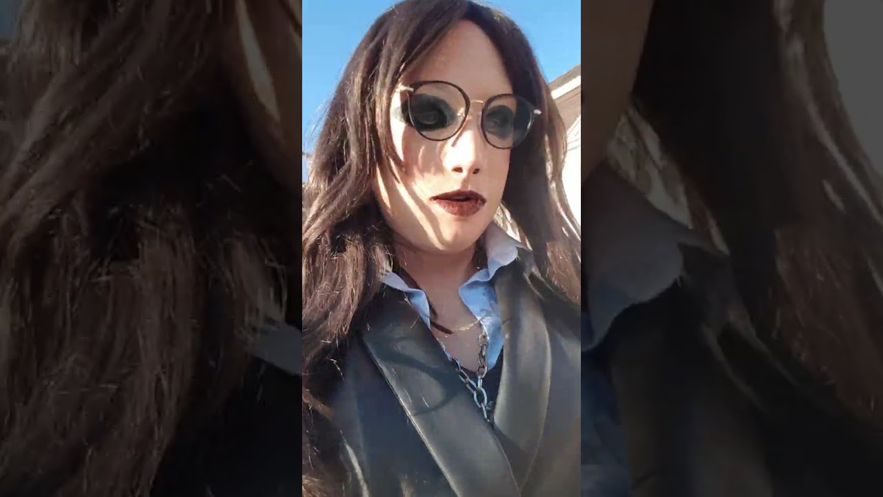 CreaFx female mask in public with high heels and leather dress