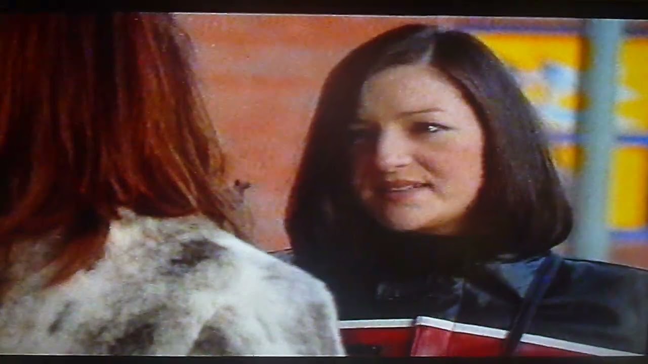 Brookside Bev Dixon throws a bucket of water over Leanne Powell January 2002