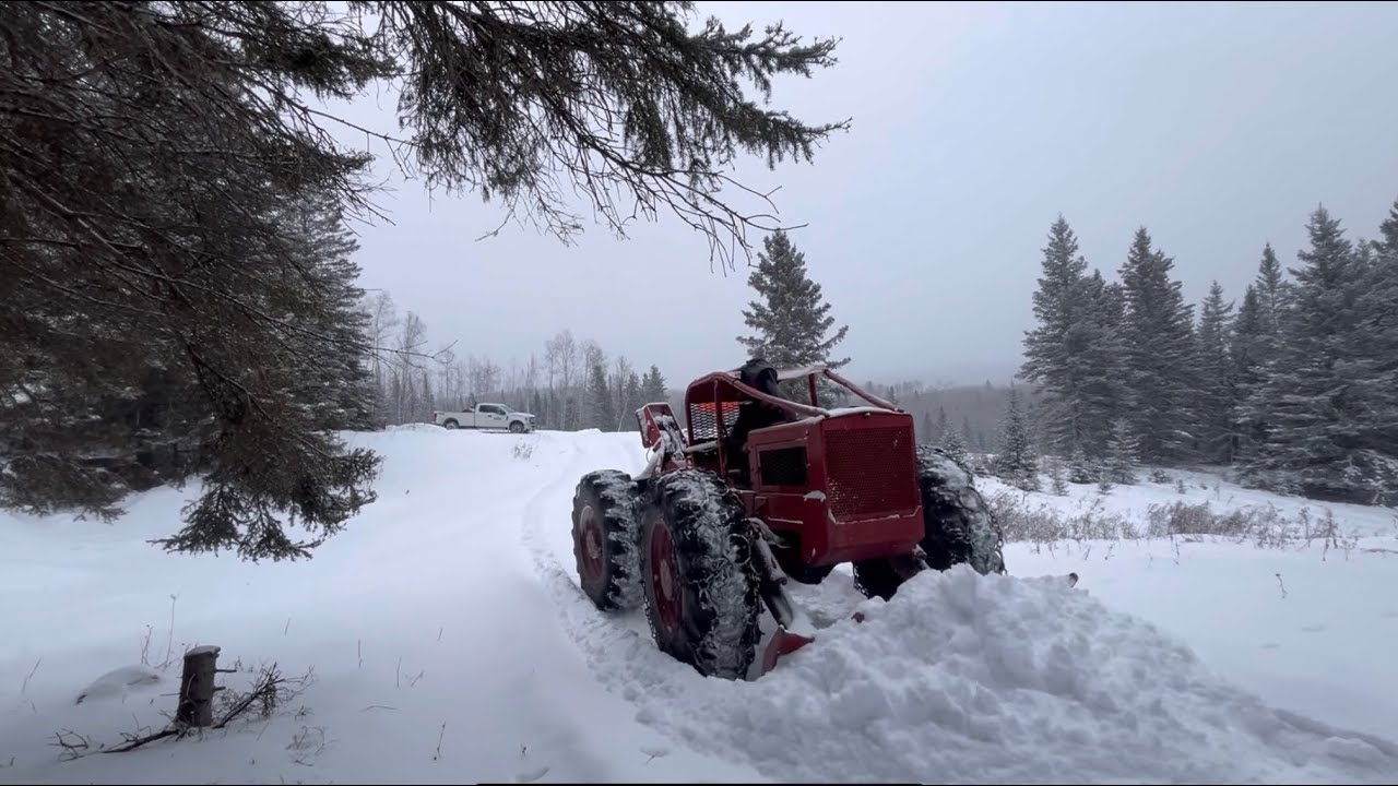230 Timberjack skidder plowing at the off grid property so we can continue with the plans