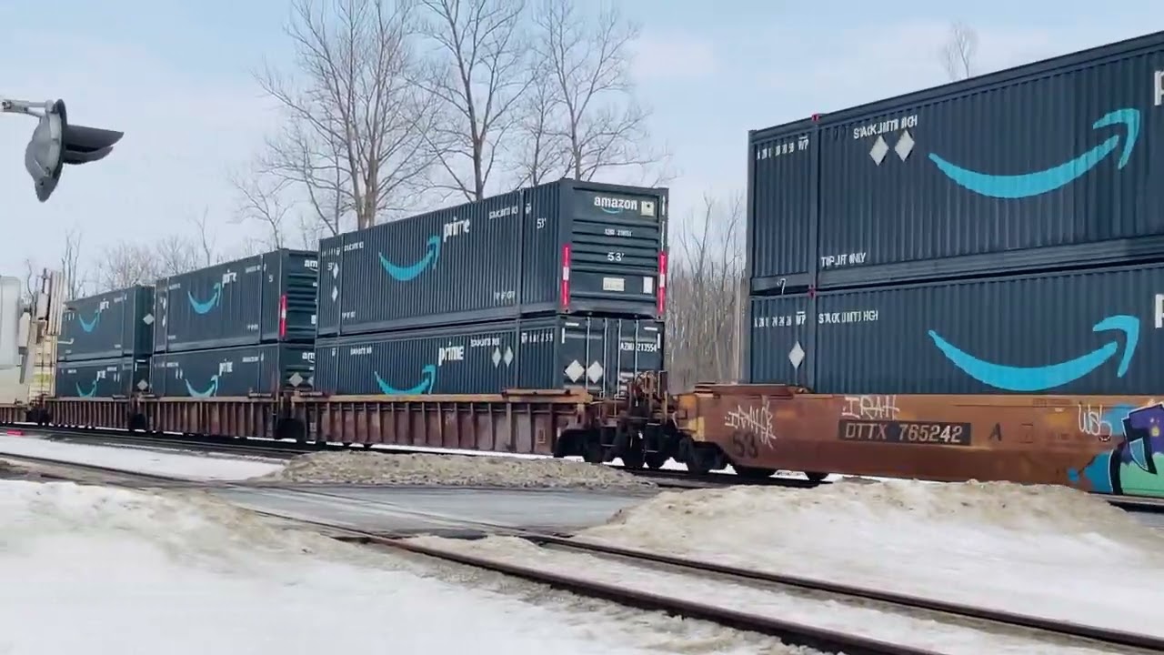 CSX 923 with a long westbound stacker meets an eastbound stacker with a sd70MAC IN KIRKVILLE
