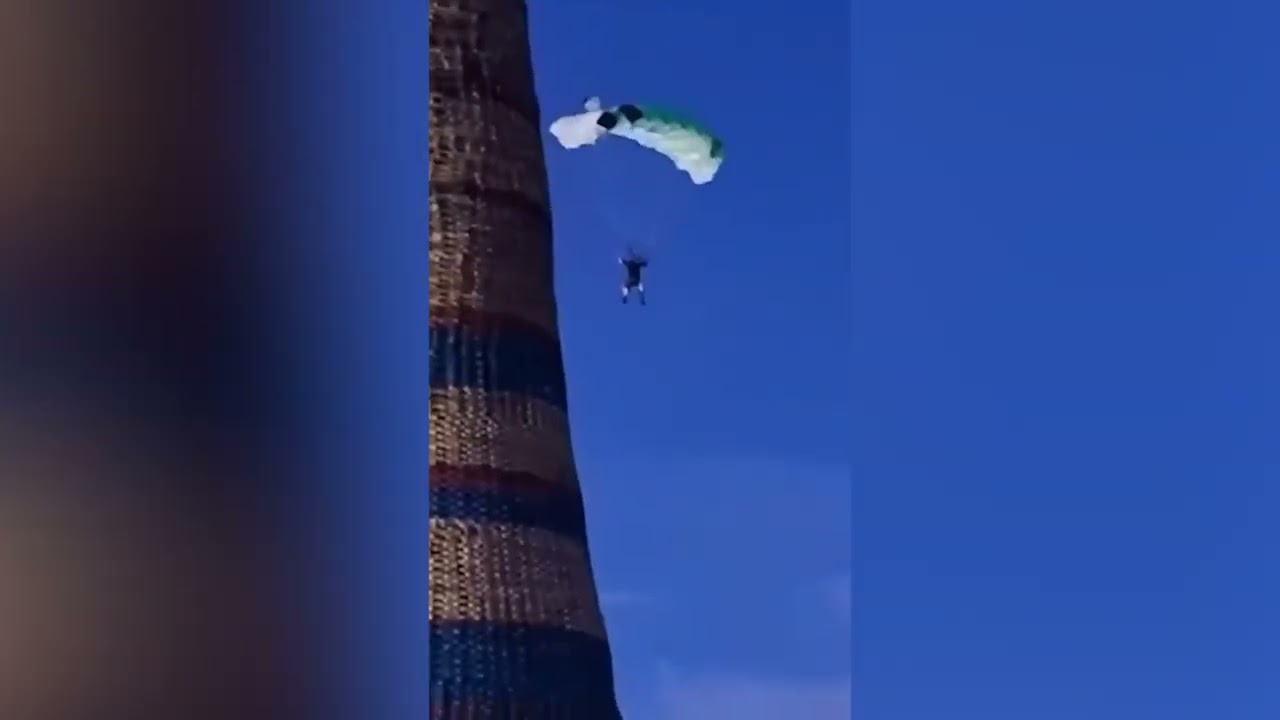 Man parachutes off 200ft tall bonfire in Northern Ireland
