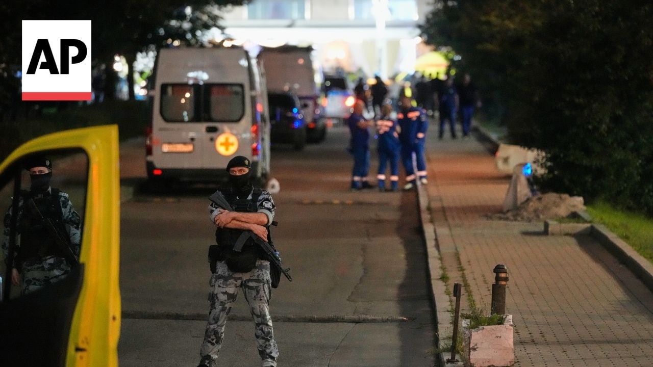 Ambulances and police at the scene in Moscow after bomb detonates at ​restaurant