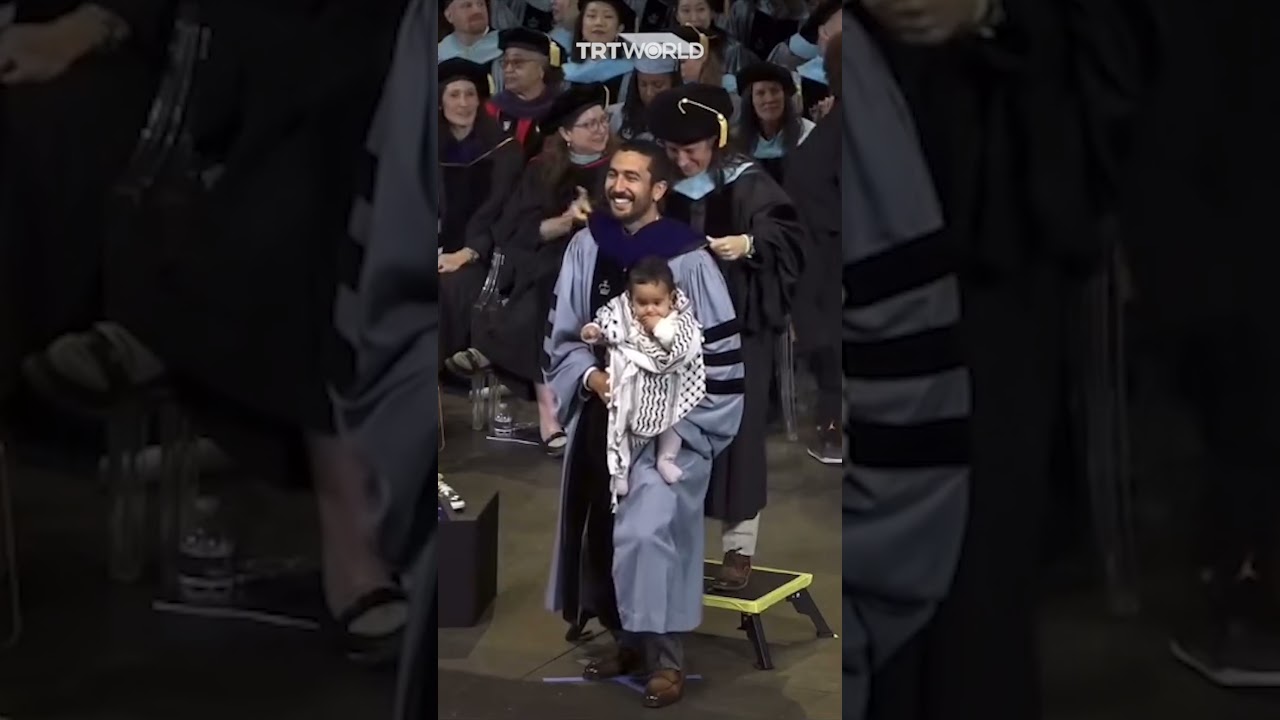 Teachers College graduate brings keffiyeh wrapped baby to graduation