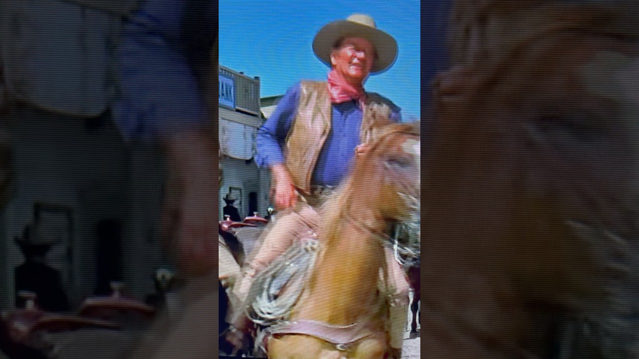 JOHN WAYNE BUYS PEPPER A DRINK.