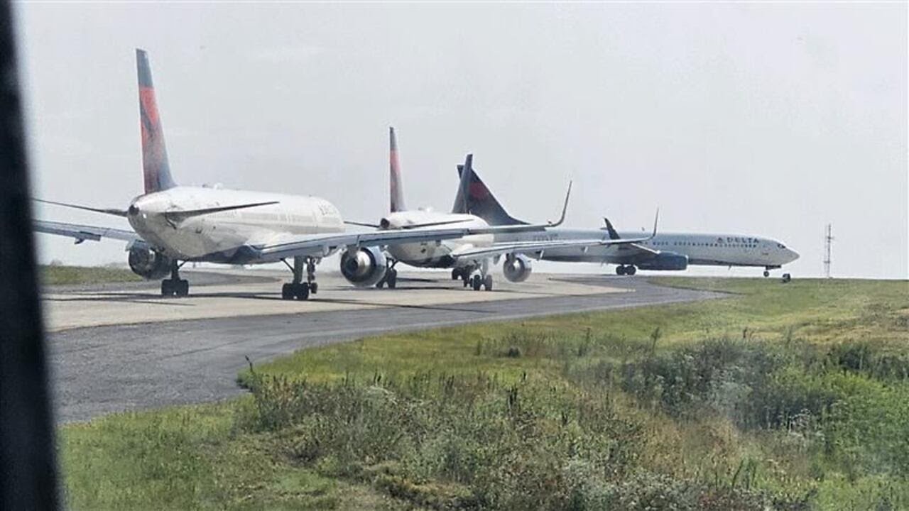 Delta plane taxiing for departure clipped by another plane at Atlanta airport