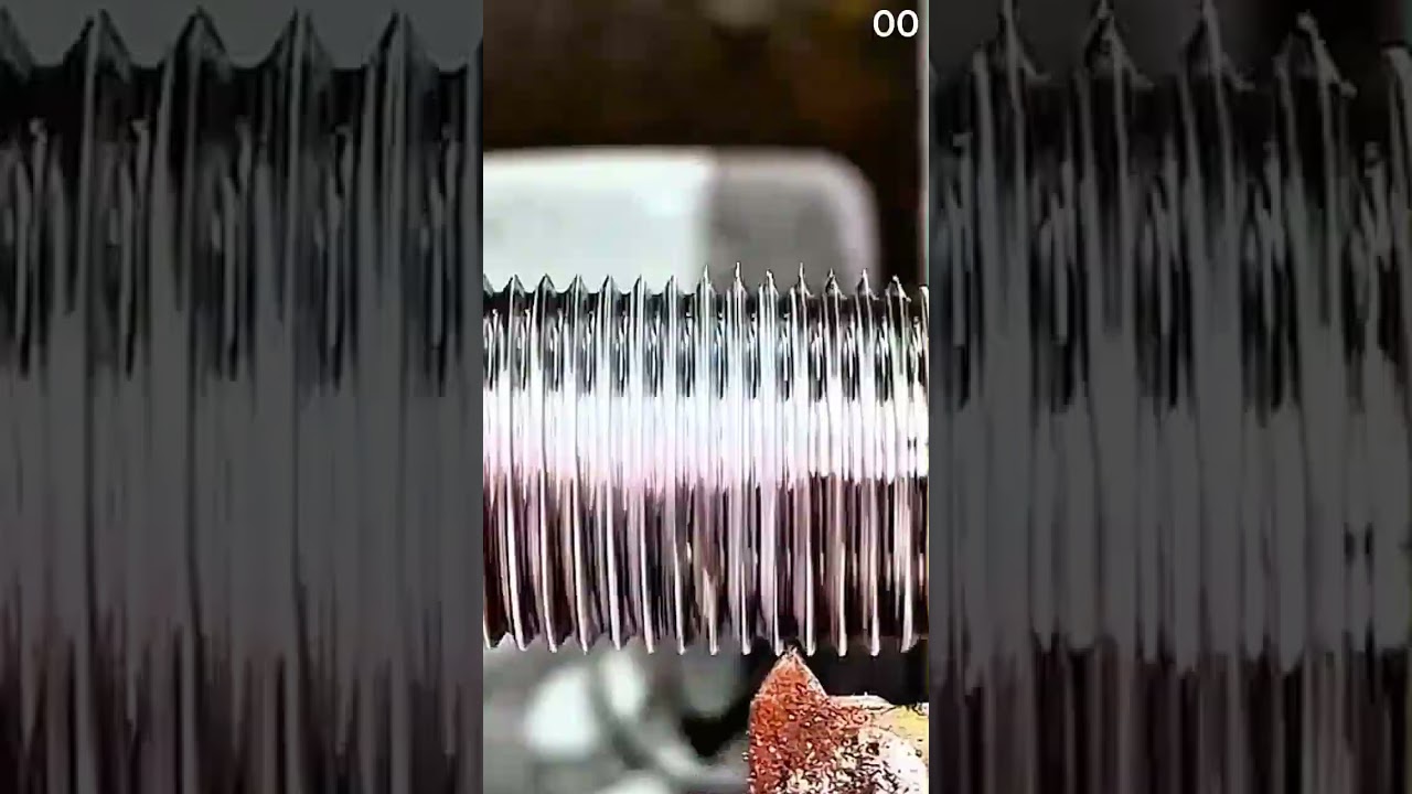 Metal threads spiral, shine dulled, corrosion clings in silence.