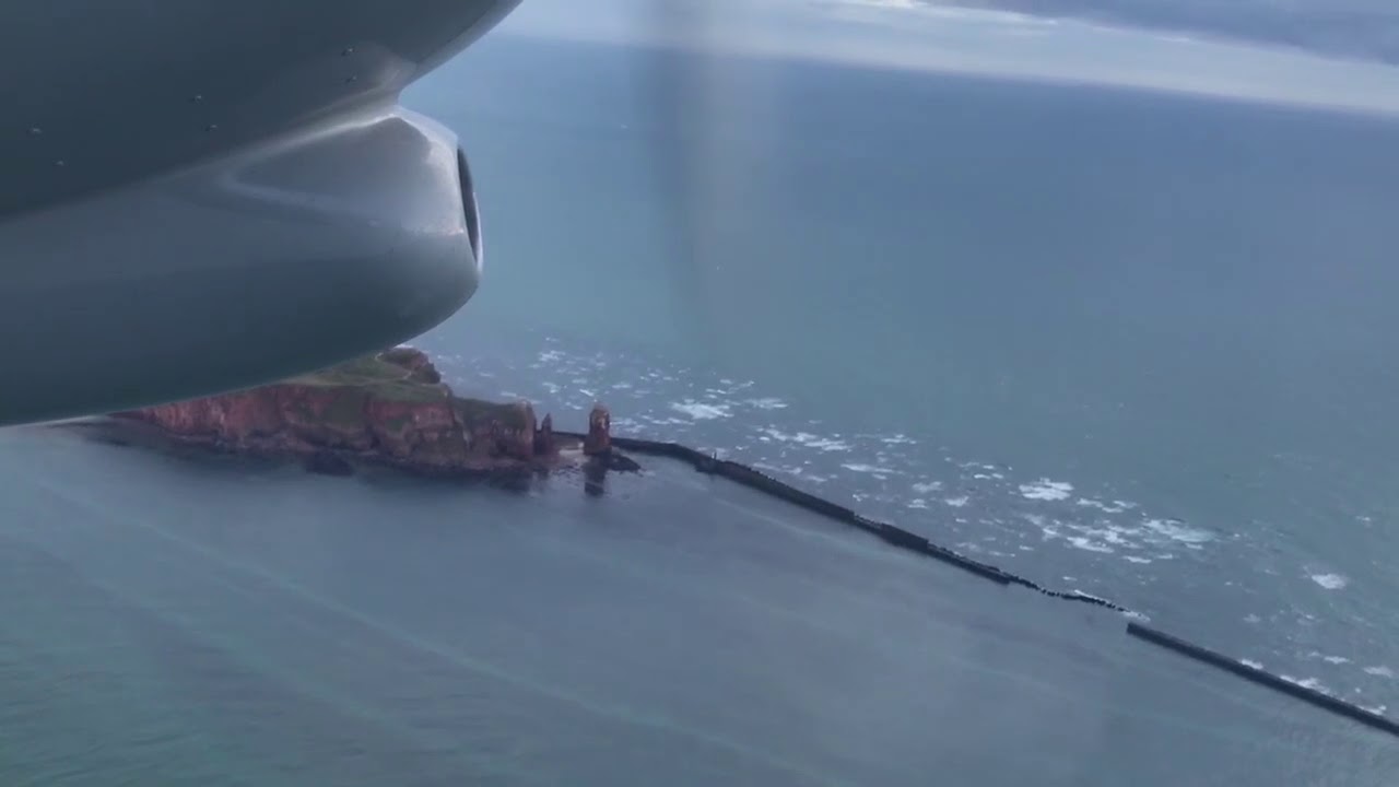 BN-2A Islander take off from Helgoland in the evening with nice view above the island