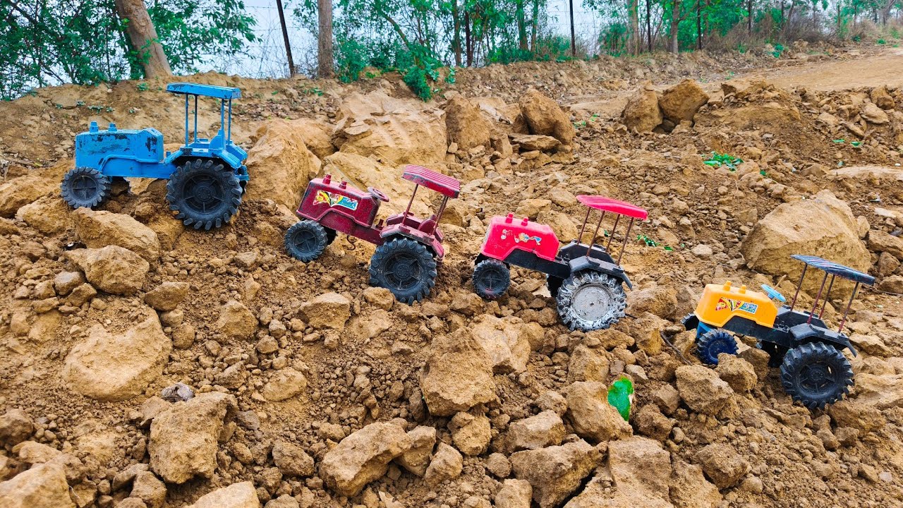 Tractors loaded small pieces of the mountain onto their trolleys and carried them away.