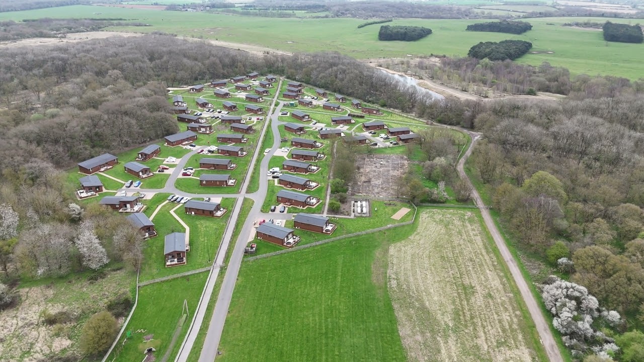 KINGS CLIFFE Airfield and holiday lodges surrounding Glenn Miller memorial on hangar base