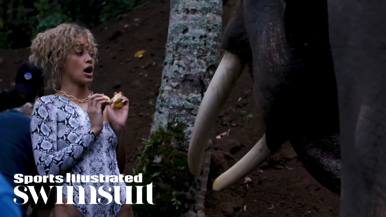 Jasmine Sanders Feeds Elephants  | In The Wild | Sports Illustrated Swimsuit