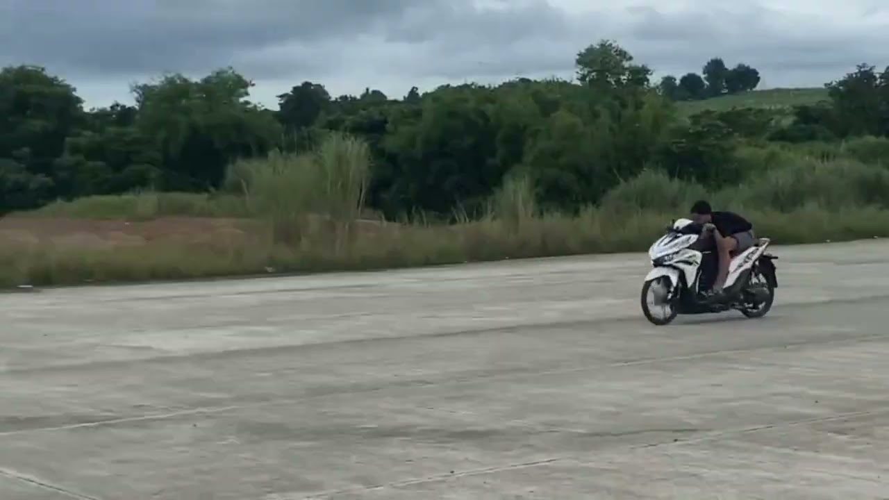 MY FRIEND TEST RUN HIS MOTORCYCLE IN THE AIRPORT