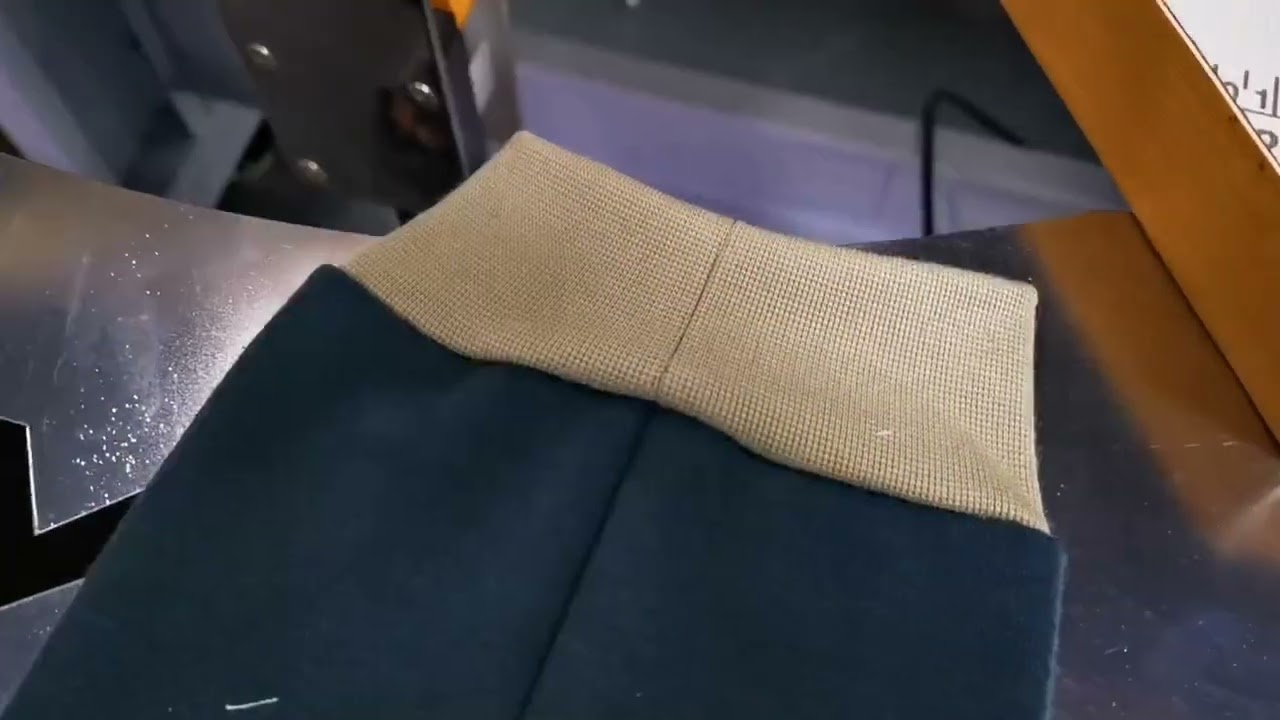 Auto rib cuff attaching machine