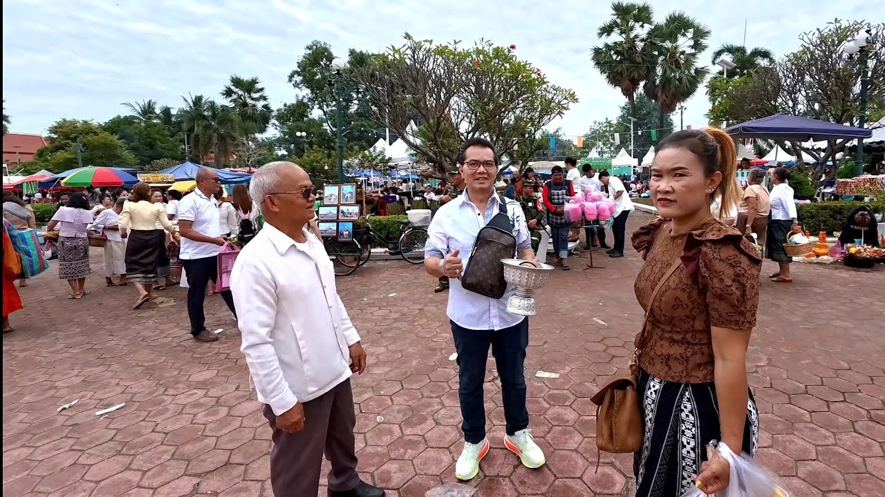 American Friends from USA at Thatluang Festival Tak Bat Ceremony in Vientiane, Laos.