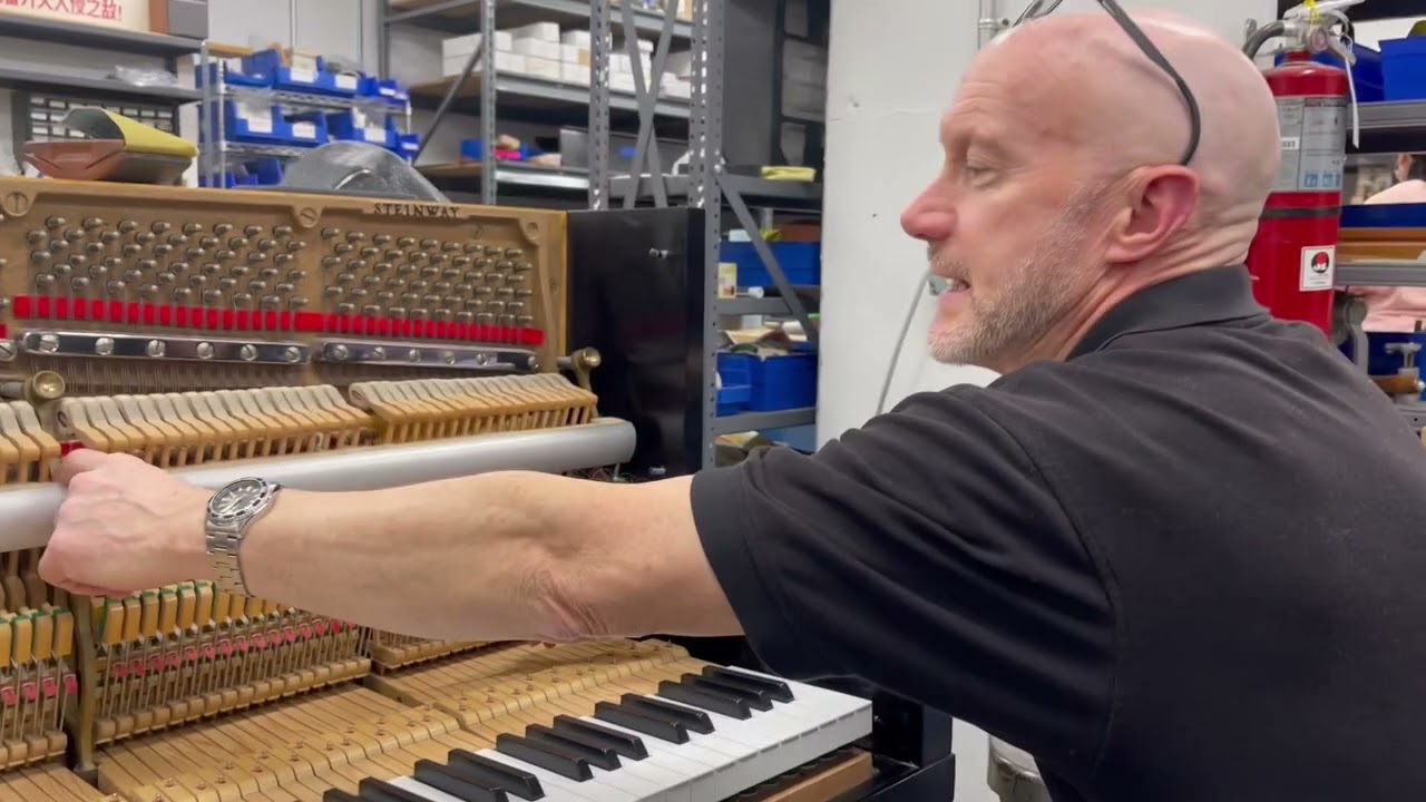 Upright hammer height regulation by Robert at the Oberlin piano shop