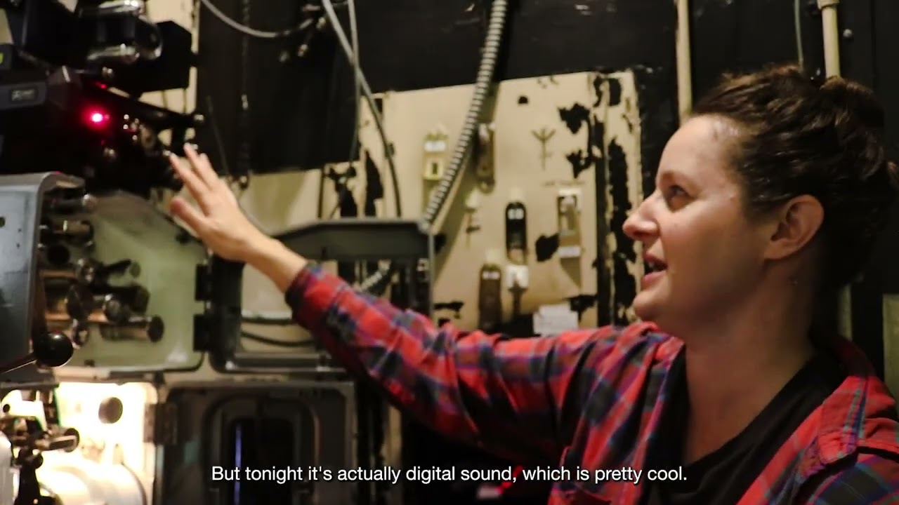 Behind the scenes of the Music Box film projection booth for TRAIN DREAMS