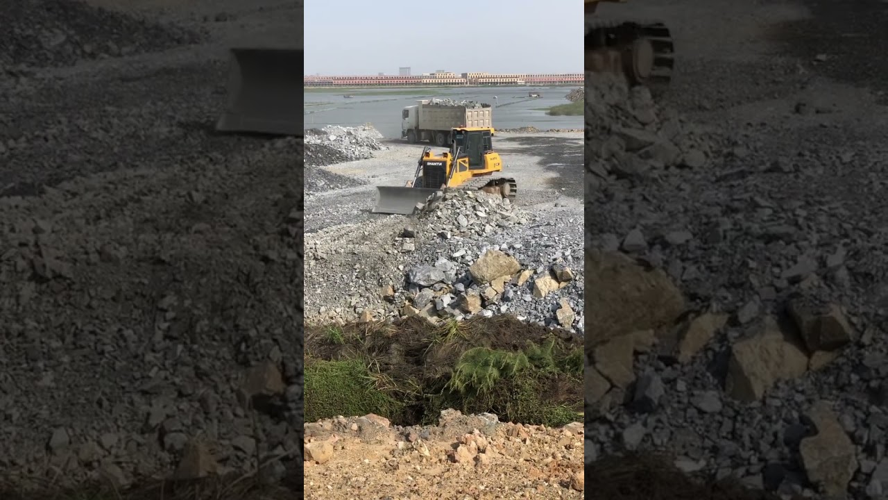 Dozer Pushing Rock on construction.