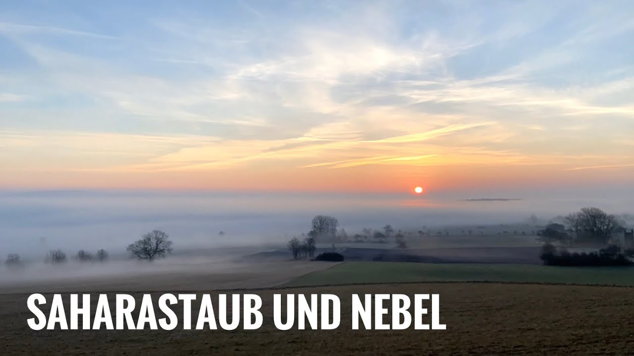 Blutmond und Blutsonne über Nebelmeer im Harzvorland