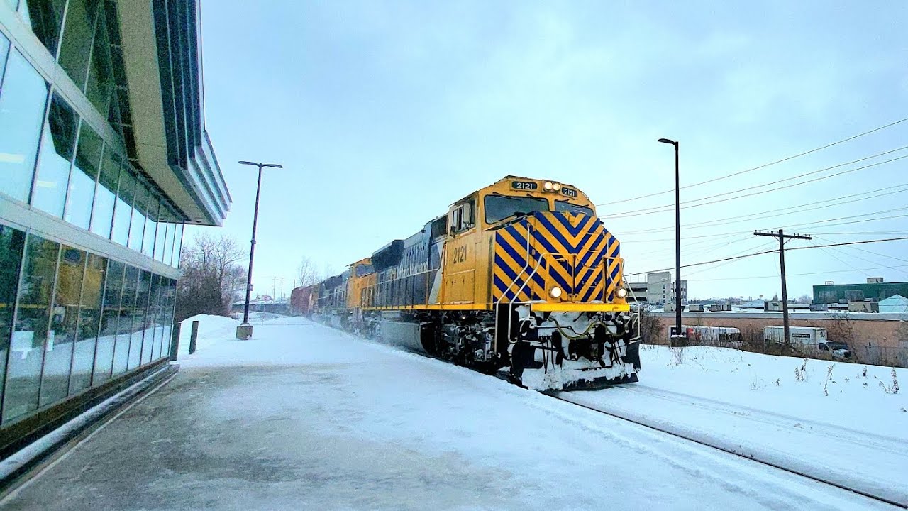 ONR 113 passing by the station with units ONR 2121 leading, ONR 2102, and ONR 2120 