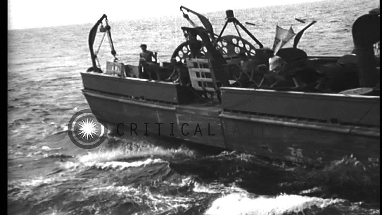 One Auxiliary Motor Minesweeper is equipped at dock while another is underway in ...HD Stock Footage
