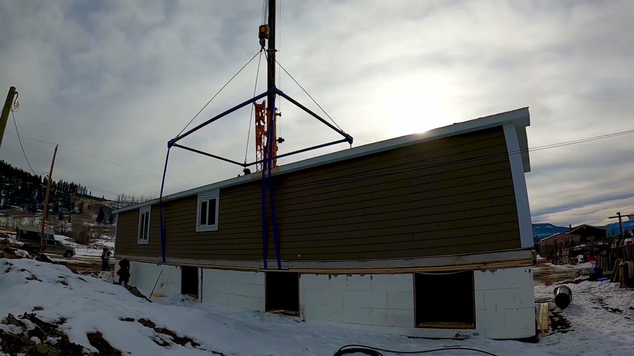 Modular home craned onto foundation.     Anaham, B.C