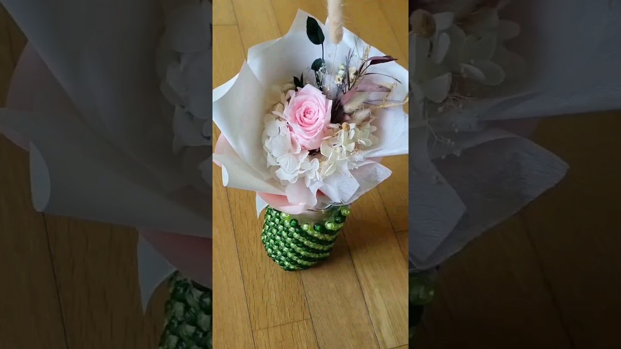 Handmade beaded flower vase for a stylish interior