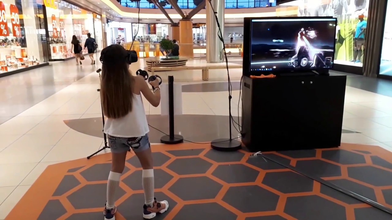 A little girl shooting Space Droids- VR Space Pirate Trainer with Oculus Rift