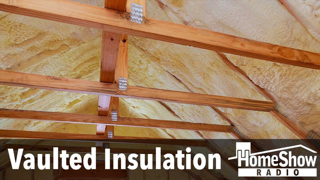 What's your advice on insulating a log cabin's vaulted ceiling?