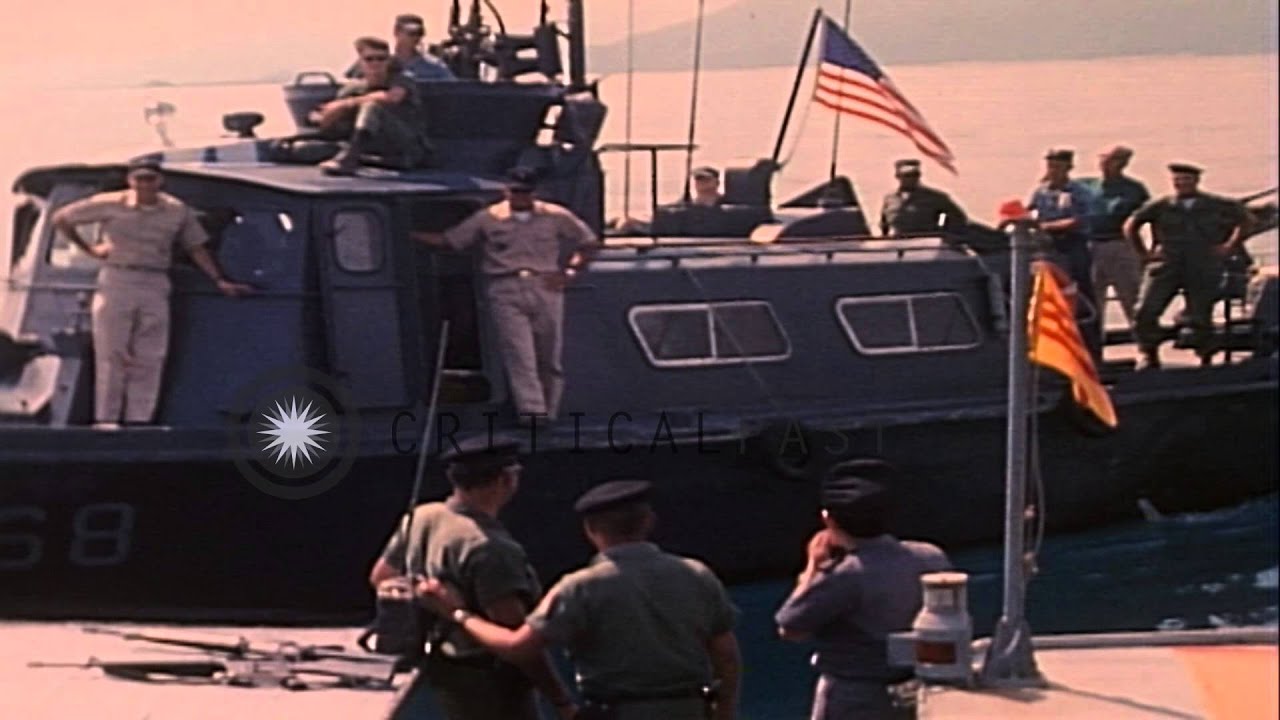 A United States Navy Swift Boat approaches Vietnamese patrol junk at a sea in Vie...HD Stock Footage