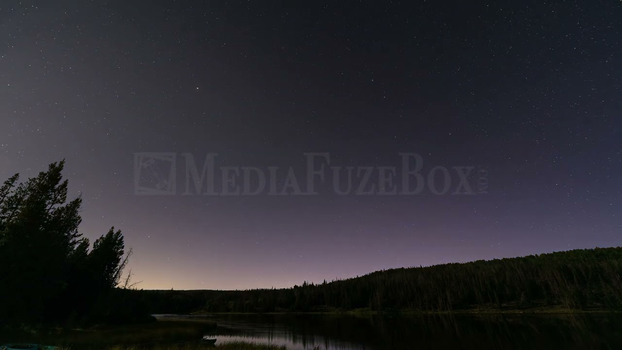 Stock Video - Astro time-lapse as dusk turns to night, and stars move through the sky