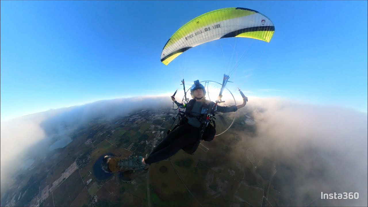 Paramotor flight up above the clouds
