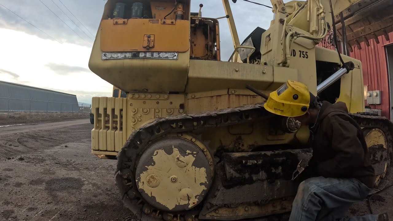 John Deere 755 track loader lift cylinder removal.