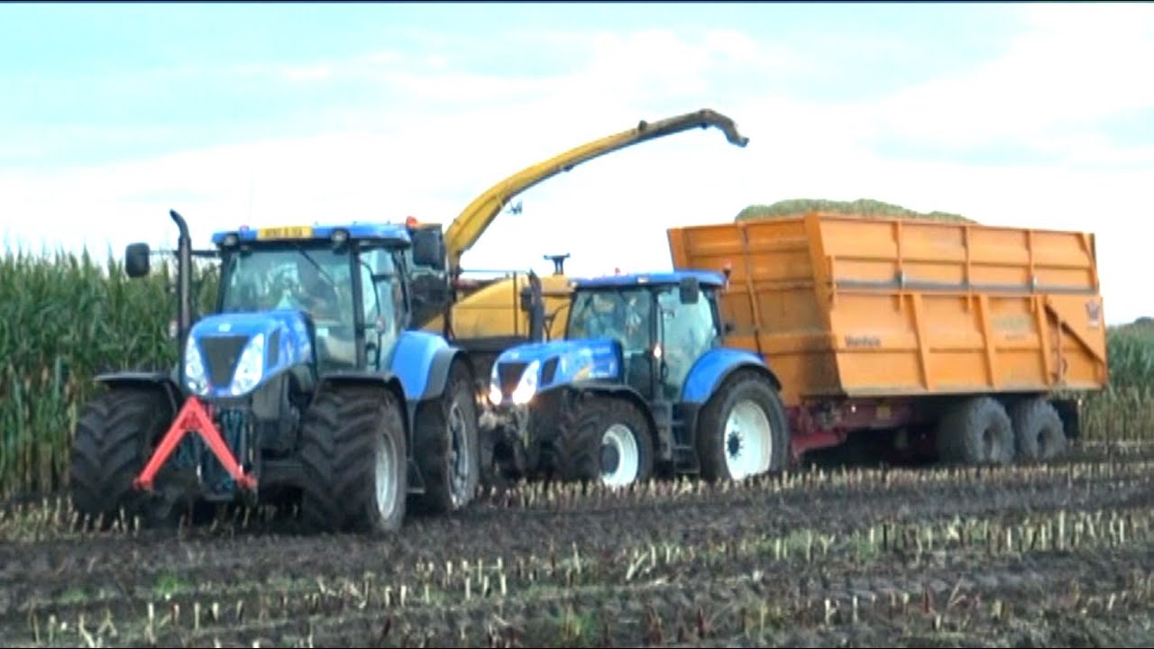 Maïs 2014 | New Holland Fr 9060 en T7 slepen samen een vastgereden NH met Veenhuis | Wet harvest