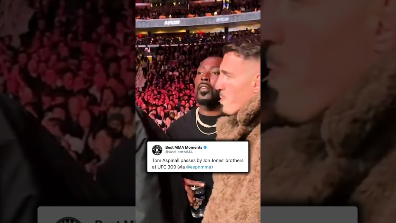 Tom Aspinall walks by Jon Jones' family at UFC 309