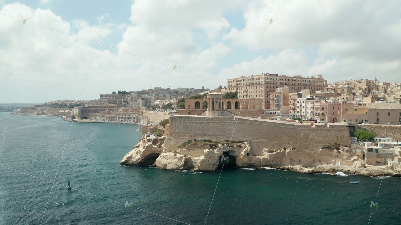Famous Siege Bell War Memorial in Valletta, Malta capital City, Aerial Drone backwards, Revealing a
