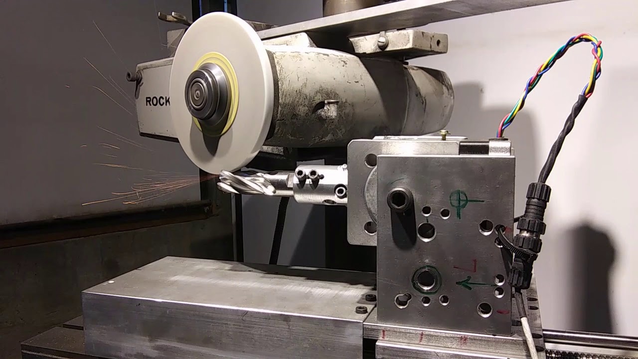 Electronic Gearing: Grinding of Helical Surfaces, End Mill Sharpening