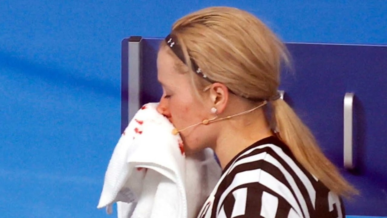 A hockey player from the USA hit the referee in the face with a stick! An eerie sight