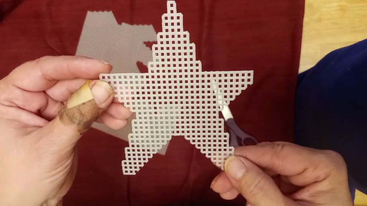 Cutting out a plastic canvas star.