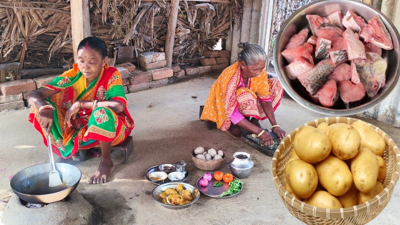 grandma&mother cooking FISH CURRY And POTATO VAJI  in village style. 