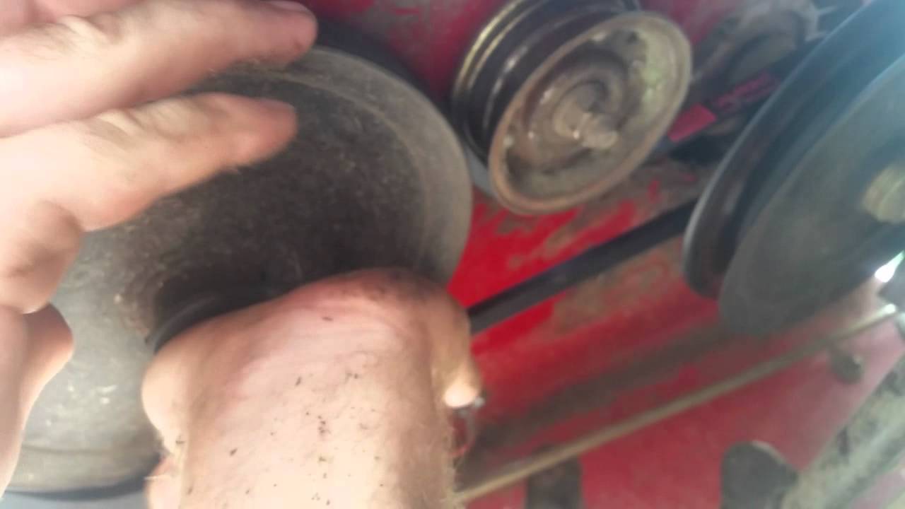 Changing exmark metro transmission drive belt.