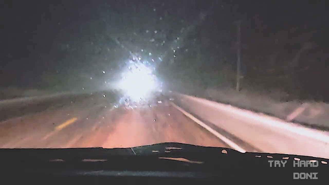 Driving Through a Snowstorm Listening to Synthwave