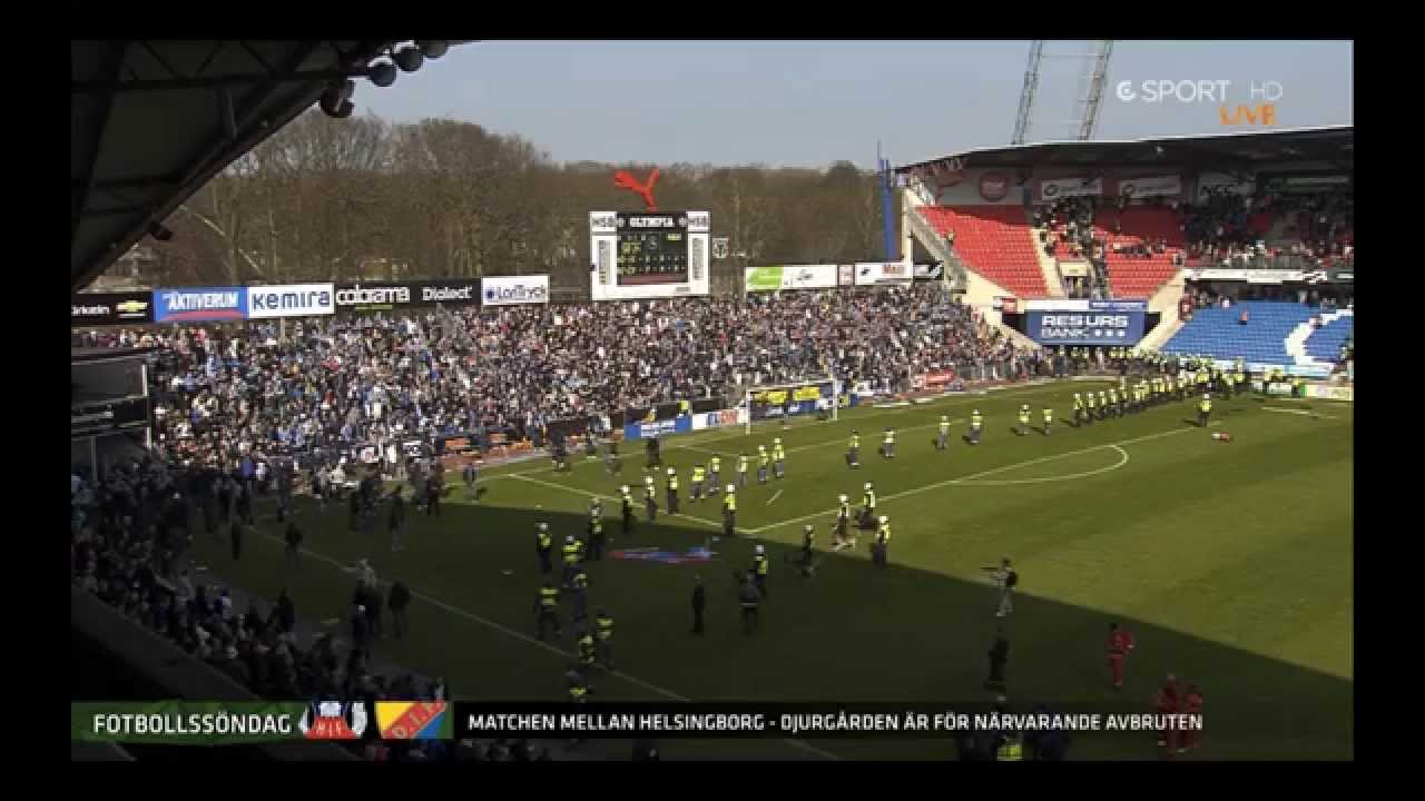 Supporters entering the field during a football game in Sweden's highest division