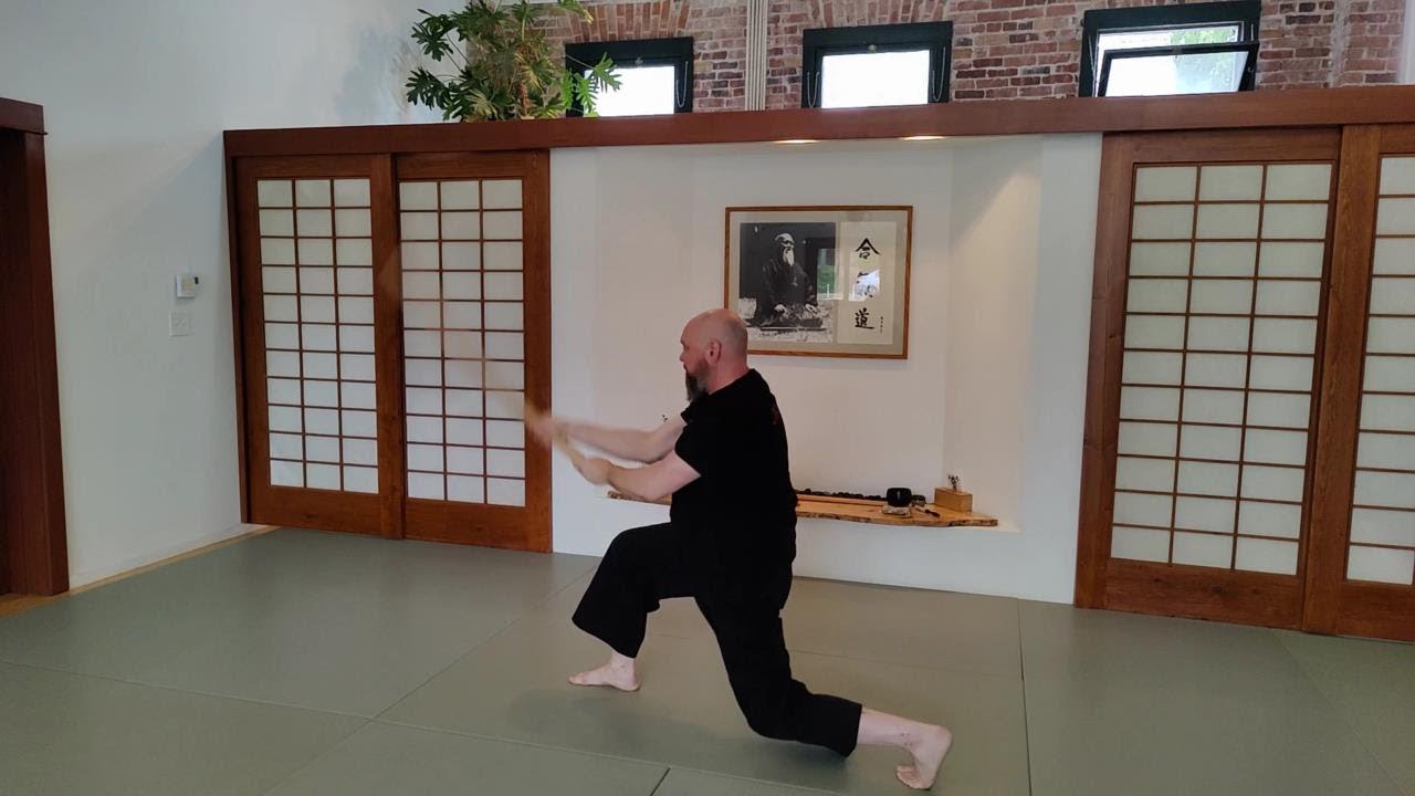 Unbowing the legs and arms to power a sword cut from kneeling