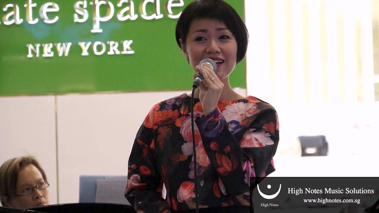 Joanna Dong performs vocal trumpet and sings 绿岛小夜曲 Lu Dao Xiao Ye Qu at Raffles City CNY