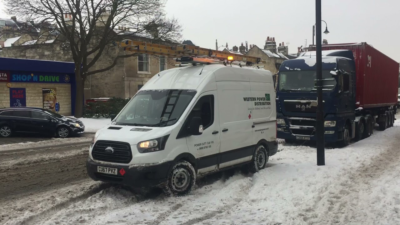 Ford transit 4x4 pulls truck In Snow