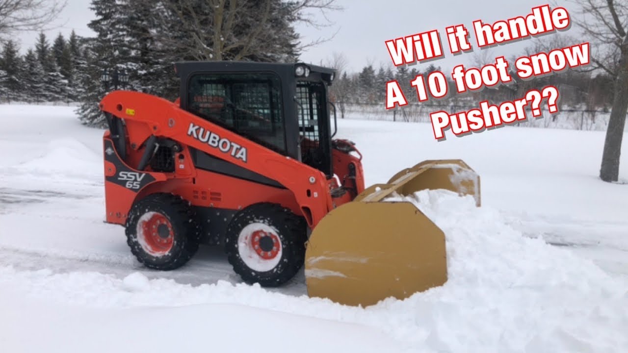 Snow Plowing with a Kubota SSV-65 using a 10 foot snow pusher!