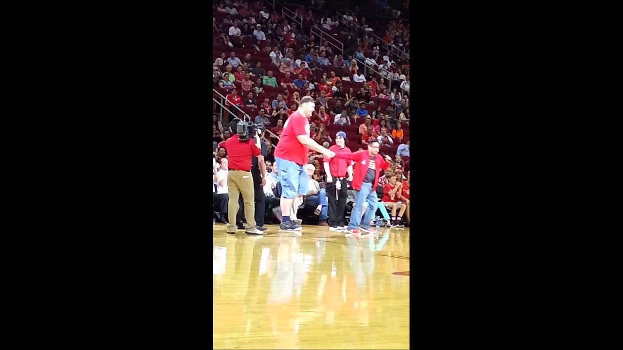 Front flip dunk over the world's tallest man.