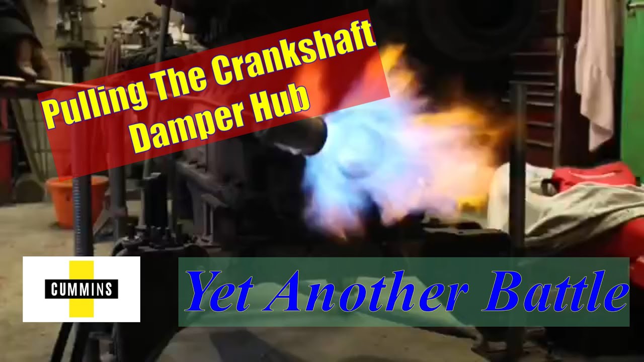 Doing battle with the crankshaft damper hub.